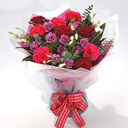 A bouquet of red and pink roses