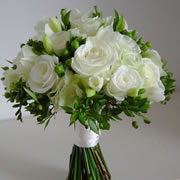 A bouquet of white roses, Freesia and Condor Hypericum